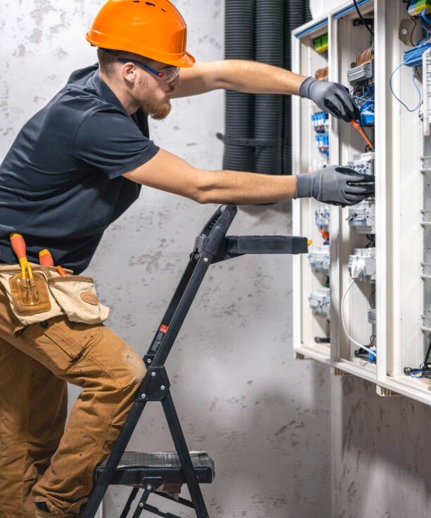 Utility technician working outdoors